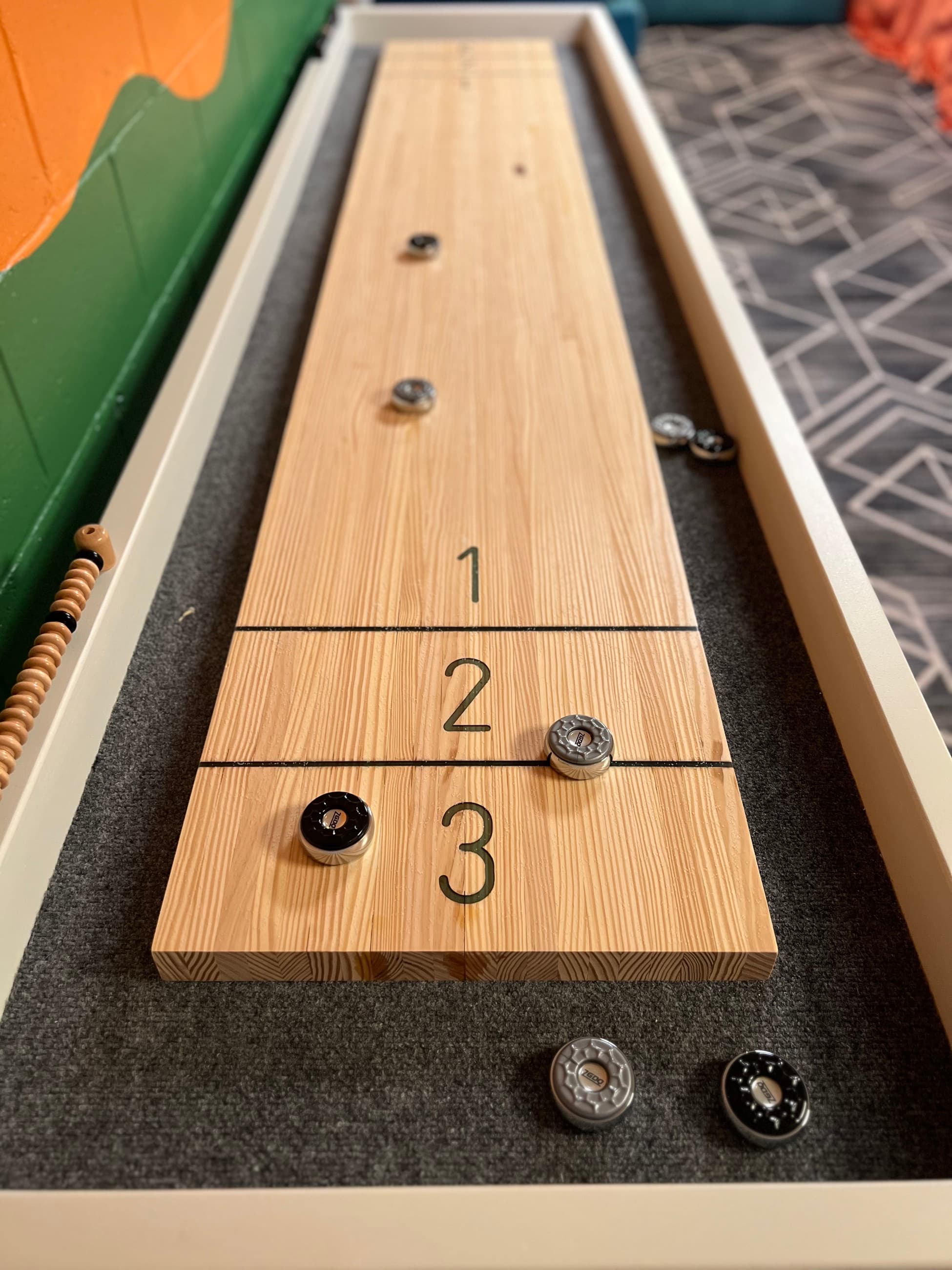 Custom shuffleboard game table built by RELIC
